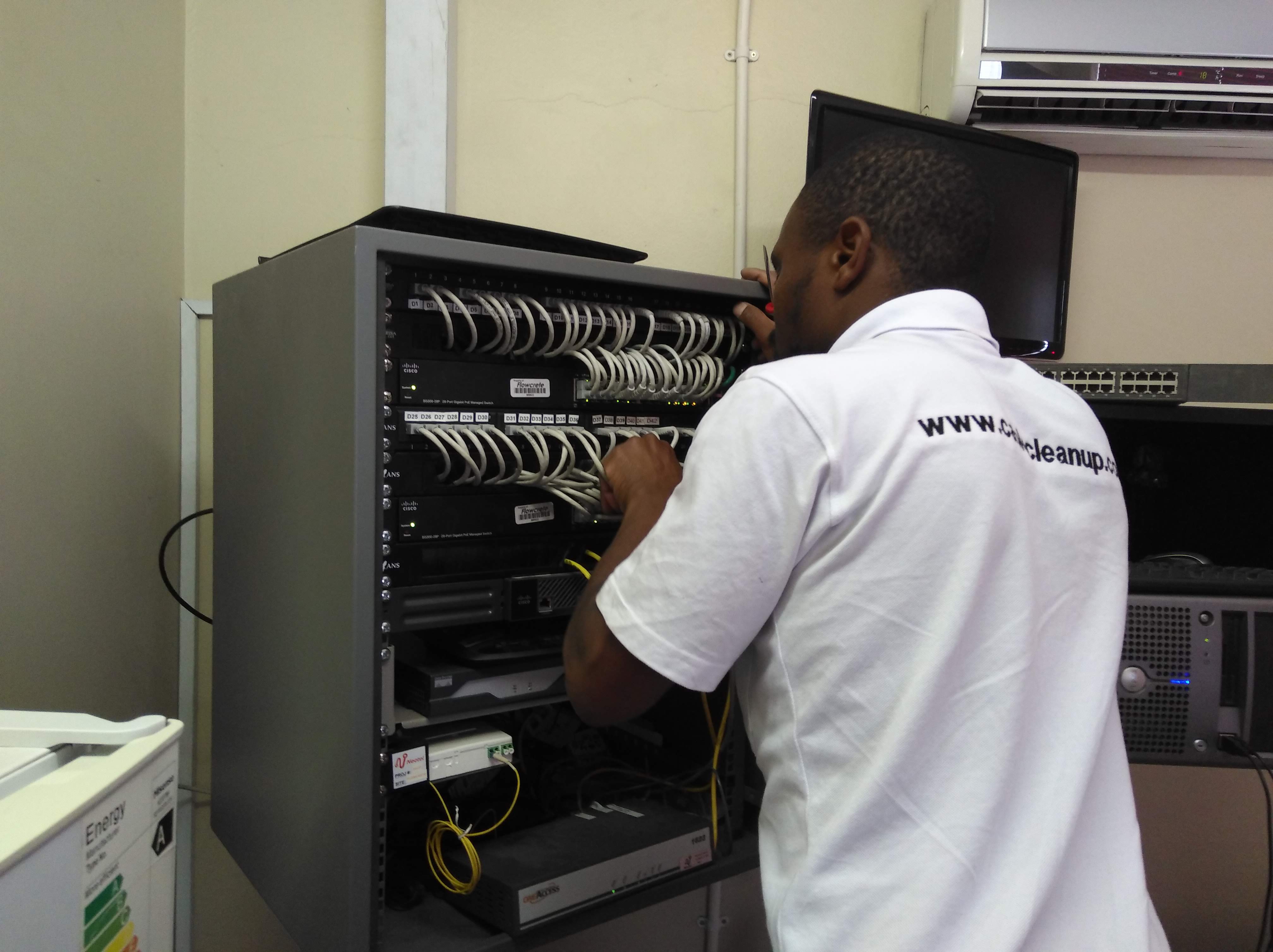 Professional network cabling technician at work